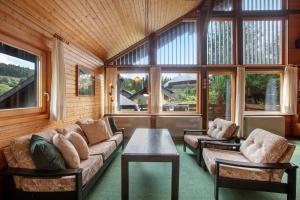 a living room with a couch and a table at Haus 7 Bernau in Bernau im Schwarzwald