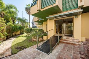 a house with a walkway leading to the front door at Manuela's whim in Málaga