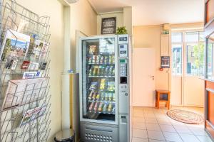 a vending machine in a store with drinks at Chambres Espace Rennaissance in Chantonnay