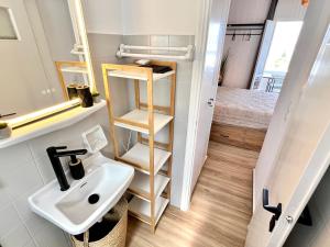 a small bathroom with a sink and a toilet at aeolian blu 6 in Parikia +36 photos