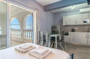a kitchen with a table with towels on it at Wavedance Accommodation in Salamina