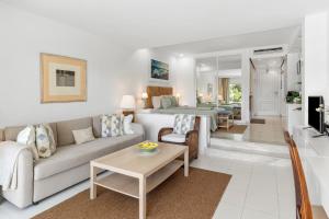 a living room with a couch and a table at Miraflores A112 in La Cala de Mijas