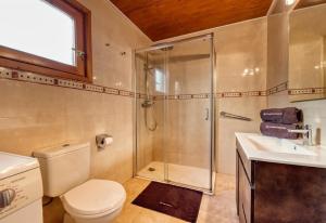 a bathroom with a shower and a toilet and a sink at Costacabana - Villa Primadonna in Lloret de Mar +9 photos