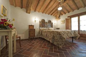 a bedroom with a large bed and a table at All Inclusive Villa Con Piscina in Camaiore +22 photos