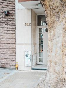a door of a building with the on it at Casa Brown in Neuquén