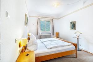 a bedroom with a bed in a room at Pension Alte Gerbe in Außerurberg