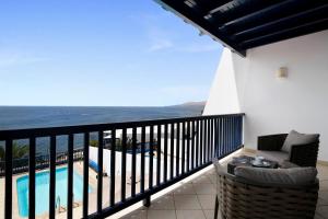 a balcony with a view of the ocean at Ajaches 23 in Puerto Calero