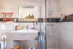 a bathroom with a sink and a shower at Un Thé sur la Loire in Ballan-Miré +19 photos