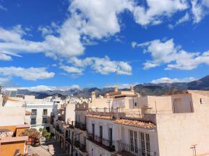 a view of a city with mountains in the background at Estudio lola in Nerja