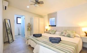 a bedroom with a large bed in a room at Collet De Manacor in Manacor