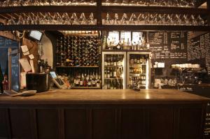 a bar with a lot of bottles of alcohol at Gales Of Llangollen in Llangollen