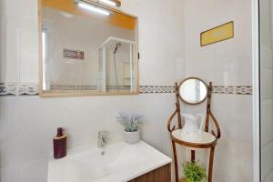 a bathroom with a sink and a mirror at House in Anaga in Almáciga