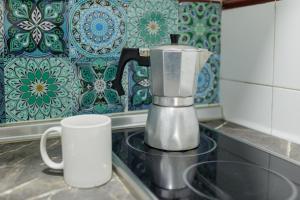 a coffee maker sitting on a counter in a kitchen at Triana Historic Center in Seville
