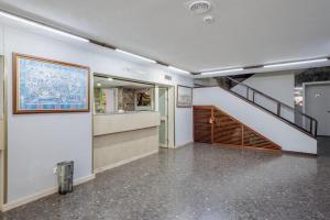 a hallway with a staircase in a building at Triana Historic Center in Seville