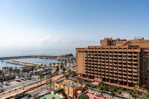 an aerial view of a city with a harbor at Penthouse with private pool in Málaga