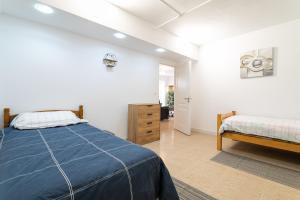 a bedroom with a bed and a dresser in it at Rr Villa in Monforte del Cid +24 photos