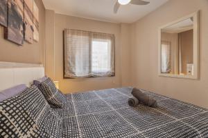 a bedroom with a large bed with a pillow on it at Cathamarcella in San Miguel de Abona +22 photos