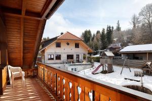 a balcony of a house with snow on the ground at Ferienhaus Schwörer in Feldberg