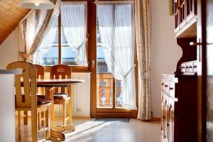 a dining room with a table and a window at Ferienhaus Schwörer in Feldberg