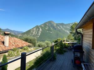 a deck with a view of a mountain at Eco Chalet - Terrasses et sauna in Sospel