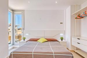 a bedroom with a large bed and a window at Villa Ronda Estación in Porreres +20 photos