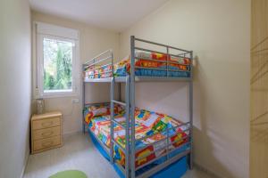 a childs bedroom with a bunk bed in a room at Apartamento Merida in Alcanar +16 photos