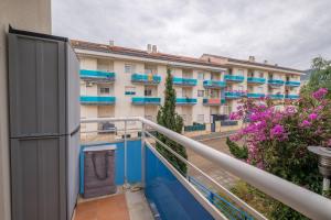 a balcony of a building with blue and white at Apartamento Merida in Alcanar