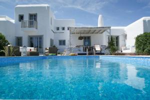 a swimming pool in front of a villa at House with private pool in Naousa