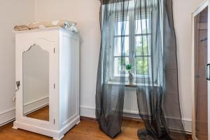 a dressing room with a mirror and a window at Haus nähe Schweiz in Kandern +34 photos