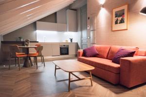 a living room with a couch and a table at Palacio Salvetti Suites in Alicante