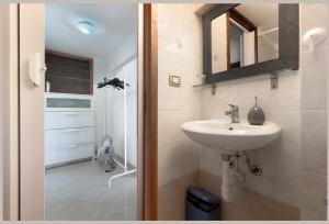 a bathroom with a sink and a mirror at Lemon Green in Celle Ligure