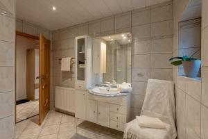 a bathroom with a sink and a mirror at Zeunerhof in Fügen +11 photos