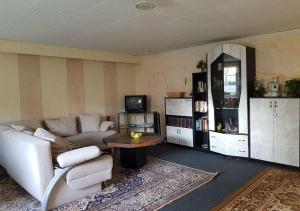 a living room with a couch and a table at Ferienhaus Fechter in Lanz +2 photos
