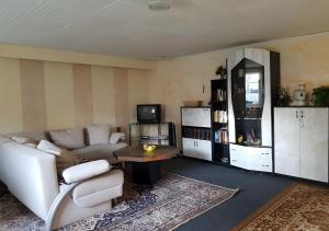 a living room with a couch and a table at Ferienhaus Fechter in Lanz