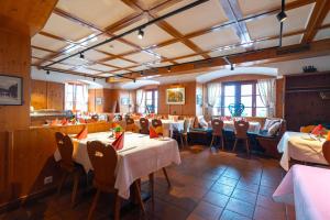 a restaurant with tables and chairs in a room at Klostermeisterhaus in St. Blasien