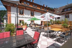 a restaurant with tables and chairs in front of a building at Klostermeisterhaus in St. Blasien