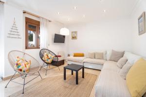 a living room with a couch and two chairs at Unique Patacona in Valencia