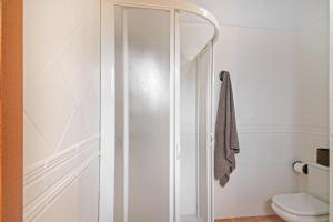a shower stall in a bathroom with a toilet at Retiro Canario in Santa Brígida +23 photos