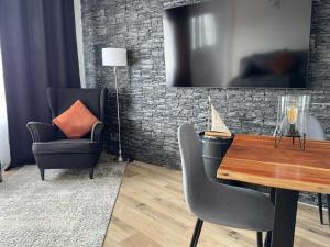 a dining room with a table and two chairs at Fewo Lago di Costanza I in Friedrichshafen