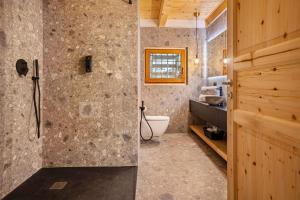 a bathroom with a shower and a toilet at Maso Rapunzel in Peio +26 photos