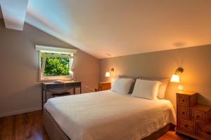 a bedroom with a large bed and a window at Afife Sea and Mountain Retreat in Afife +17 photos