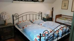 a bedroom with a bed with two pillows at Ferienhaus Roman in Hinterstoder