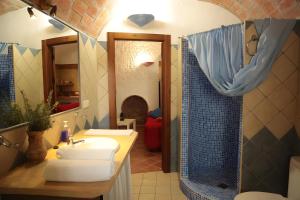 a bathroom with a sink and a shower at Los Cerezos in Benalúa de Guadix +2 photos