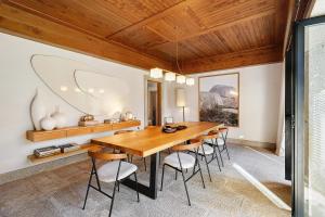a dining room with a wooden table and chairs at Casa Do Alto Da Coutada in Ponte de Lima