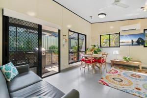 a living room with a couch and a table at Ingenia Holidays Noosa North in Tewantin