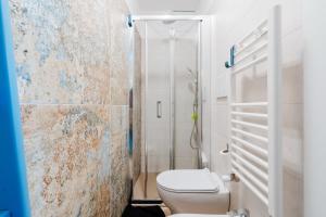 a bathroom with a toilet and a shower at Casa Ninì in Galatone +15 photos