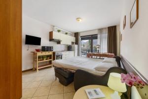 a small room with a bed and a kitchen at Como's Lake Mountains beb in Cremeno