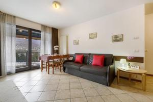 a living room with a couch and a table at Como's Lake Mountains beb in Cremeno +14 photos