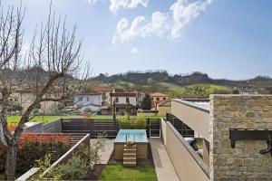 a patio with a table on the roof of a house at Isola Degli Angeli in Reggello