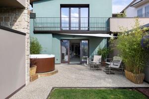 a patio with chairs and a balcony on a house at Isola Degli Angeli in Reggello